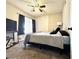 Comfortable bedroom features a bed, a ceiling fan, and a bedside lamp for added comfort at 2600 Congress Ave, Las Vegas, NV 89121