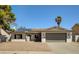 Single-story home with solar panels, attached garage, and landscaped yard at 2600 Congress Ave, Las Vegas, NV 89121
