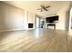 Inviting living area featuring a classic brick fireplace, ceiling fan, and ample space for entertaining guests or relaxing at 2600 Congress Ave, Las Vegas, NV 89121
