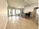 Bright and airy living room featuring a ceiling fan, tile floors, and sliding glass doors to enjoy indoor/outdoor living at 2600 Congress Ave, Las Vegas, NV 89121