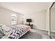 Bright bedroom with grey carpet and a wall-mounted TV at 2987 Juniper Hills Blvd # 104, Las Vegas, NV 89142