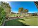 Backyard with artificial turf and golf course view at 4829 E Beacon Ridge Dr, Pahrump, NV 89061