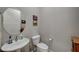 Small bathroom with toilet and sink at 4829 E Beacon Ridge Dr, Pahrump, NV 89061