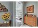 View of bedroom from hallway, featuring a dresser and glimpse of bed at 4829 E Beacon Ridge Dr, Pahrump, NV 89061