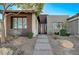 Modern home exterior with attractive landscaping and entryway at 4829 E Beacon Ridge Dr, Pahrump, NV 89061