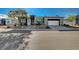 Single-story home with modern facade, two-car garage, and landscaped front yard at 4829 E Beacon Ridge Dr, Pahrump, NV 89061