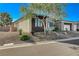 Single-story home with attractive landscaping and a two-car garage at 4829 E Beacon Ridge Dr, Pahrump, NV 89061