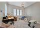 Bright home office with a desk, exercise bike, and weight bench at 4829 E Beacon Ridge Dr, Pahrump, NV 89061