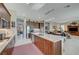 Open concept kitchen with island and granite countertops, stainless steel appliances at 4829 E Beacon Ridge Dr, Pahrump, NV 89061