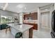 Modern kitchen features a large island with seating and granite countertops at 4829 E Beacon Ridge Dr, Pahrump, NV 89061