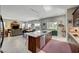 Open concept kitchen with island, stainless steel appliances, and views to Gathering room at 4829 E Beacon Ridge Dr, Pahrump, NV 89061