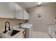 Laundry room with washer, dryer, and sink at 4829 E Beacon Ridge Dr, Pahrump, NV 89061