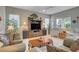Bright living room with ample seating and a large TV at 4829 E Beacon Ridge Dr, Pahrump, NV 89061