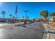 Community entrance with ample parking and flag at 5710 E Tropicana Ave # 2017, Las Vegas, NV 89122