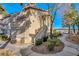 Exterior view showing building entrance and landscaping at 5710 E Tropicana Ave # 2017, Las Vegas, NV 89122