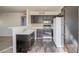 Kitchen features dark wood cabinets and white appliances at 5710 E Tropicana Ave # 2017, Las Vegas, NV 89122