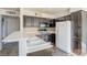 Kitchen features dark wood cabinets and white appliances at 5710 E Tropicana Ave # 2017, Las Vegas, NV 89122