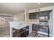 Kitchen features dark wood cabinets and white appliances at 5710 E Tropicana Ave # 2017, Las Vegas, NV 89122