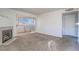 Living room with fireplace, sliding glass door to patio, and carpet flooring at 5710 E Tropicana Ave # 2017, Las Vegas, NV 89122