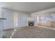 Living room with fireplace and sliding glass doors to patio at 5710 E Tropicana Ave # 2017, Las Vegas, NV 89122