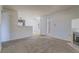 Living room with high ceilings, neutral color palette, and carpet flooring at 5710 E Tropicana Ave # 2017, Las Vegas, NV 89122