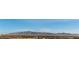 Expansive city view showcasing the nearby mountains and the residential neighborhoods below on a clear day at 700 W Carson Ave # 808, Las Vegas, NV 89106