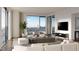 Modern living room boasts stunning city views from large windows at 700 W Carson Ave # 808, Las Vegas, NV 89106