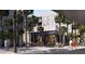 Upscale retail center with outdoor seating and palm trees at 700 W Carson Ave # 808, Las Vegas, NV 89106