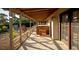 Covered back patio with hot tub and access to the yard at 749 Rossmore Dr, Las Vegas, NV 89110