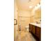 Updated bathroom with a large vanity and tiled floor at 749 Rossmore Dr, Las Vegas, NV 89110