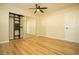 Spacious bedroom with mirrored closet and ceiling fan at 749 Rossmore Dr, Las Vegas, NV 89110