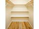 Walk-in closet with shelving and light wood flooring at 749 Rossmore Dr, Las Vegas, NV 89110