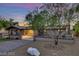 House exterior at dusk, showcasing landscaping and driveway at 749 Rossmore Dr, Las Vegas, NV 89110