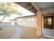 Ranch style home with brick columns, landscaped walkway, and mature tree at 749 Rossmore Dr, Las Vegas, NV 89110