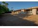 Ranch style home with gravel yard and palm trees at 749 Rossmore Dr, Las Vegas, NV 89110