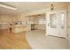 Open concept kitchen with island and hardwood floors at 749 Rossmore Dr, Las Vegas, NV 89110