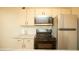Closeup of kitchen with granite countertop and microwave at 749 Rossmore Dr, Las Vegas, NV 89110
