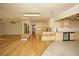 Open concept kitchen with hardwood floors and light cabinets at 749 Rossmore Dr, Las Vegas, NV 89110
