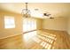 Spacious living area with hardwood floors and a modern chandelier at 749 Rossmore Dr, Las Vegas, NV 89110