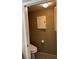 Small half bathroom with toilet and storage cabinet at 9000 Las Vegas Blvd # 1013, Las Vegas, NV 89123