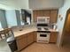 Kitchen with white appliances and light wood cabinets at 9000 Las Vegas Blvd # 1013, Las Vegas, NV 89123