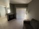 Bright living room with fireplace, sliding door, and tile floors at 9000 Las Vegas Blvd # 1013, Las Vegas, NV 89123