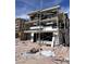 Modern two-story home under construction with scaffolding against a blue sky at 9132 Vesey Ave, Las Vegas, NV 89148