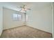 Bright bedroom featuring neutral walls and plush carpeting at 1624 Ravanusa Dr, Henderson, NV 89052