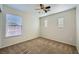 Spacious bedroom with neutral walls, carpeting, and window blinds at 1624 Ravanusa Dr, Henderson, NV 89052