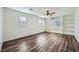 Large bedroom with built-in shelving and wood-look flooring at 1624 Ravanusa Dr, Henderson, NV 89052