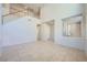Two-story living room with high ceilings,tile floors, and staircase at 1624 Ravanusa Dr, Henderson, NV 89052