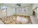 Spacious living room with tile floors, fireplace, and large windows at 1624 Ravanusa Dr, Henderson, NV 89052