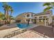 Inviting backyard oasis with a sparkling pool and spa at 1624 Ravanusa Dr, Henderson, NV 89052
