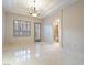 Bright dining room with tile floors and chandelier at 1665 Liege Dr, Henderson, NV 89012